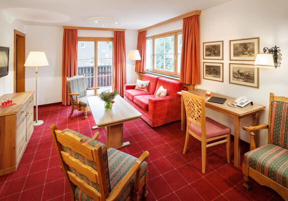 The elegantly traditional furnished living room of the suite 