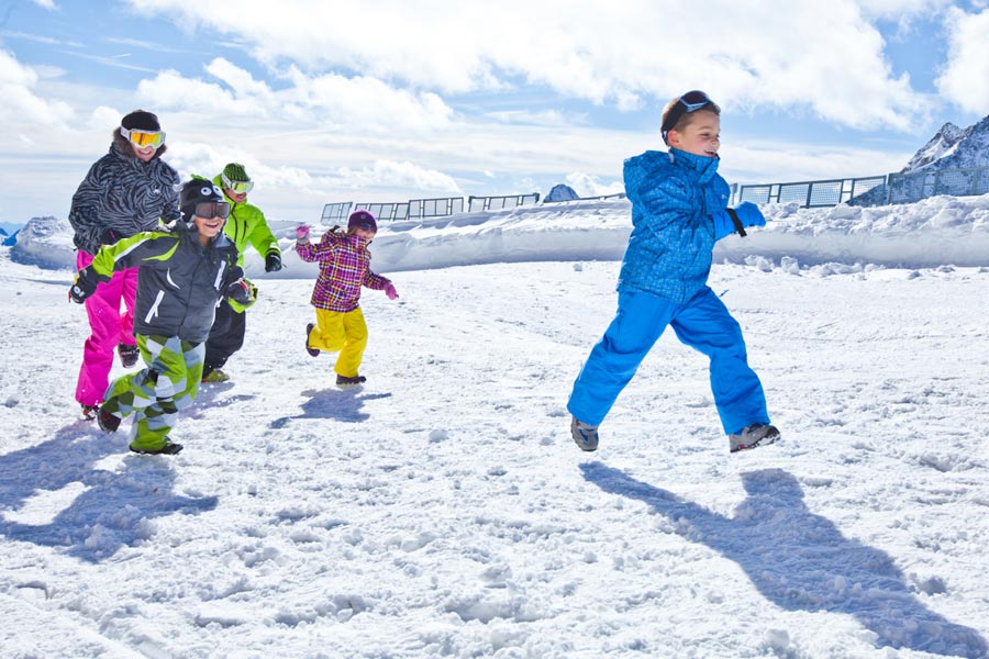 Kids playing catch in the snow